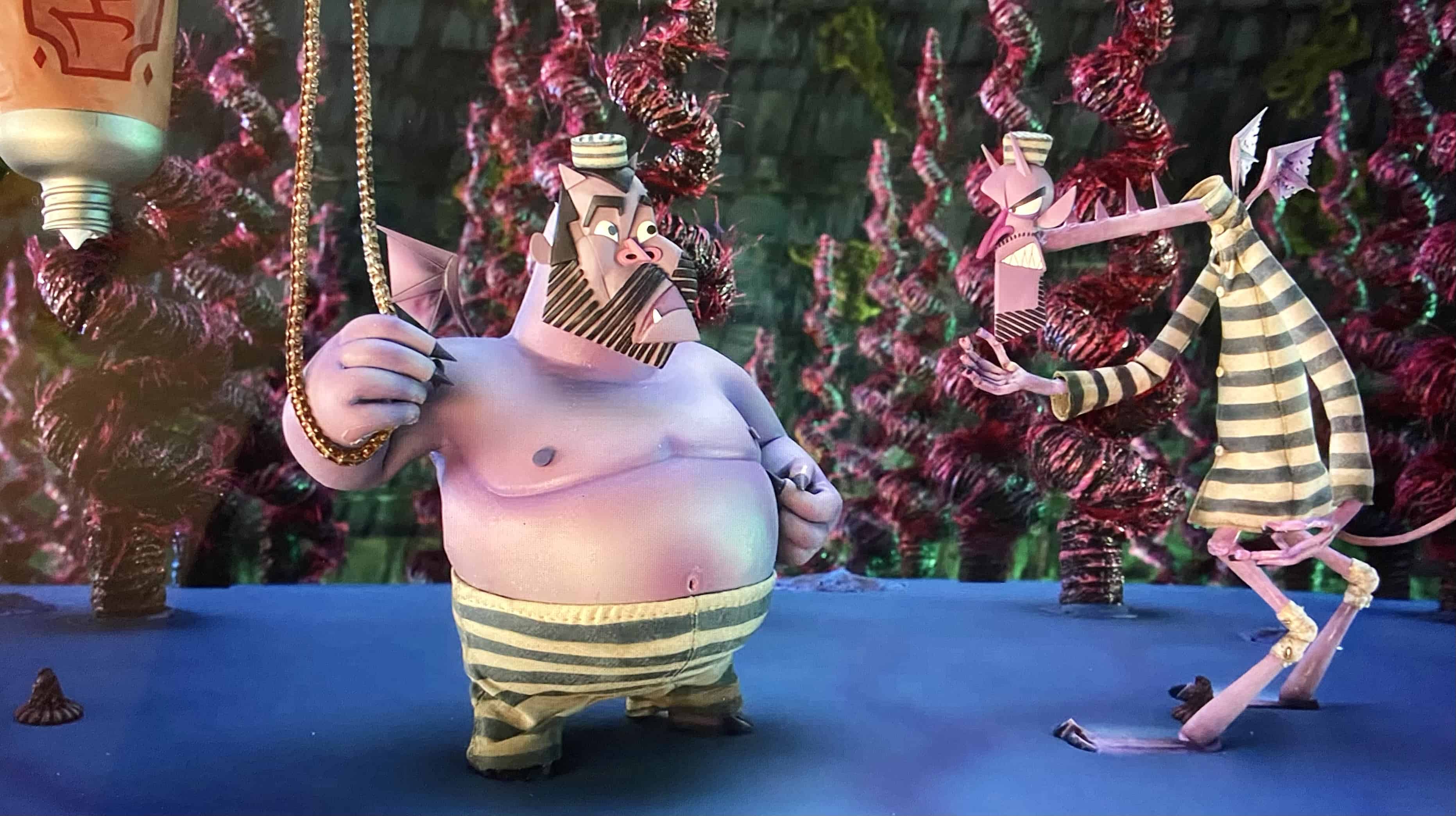 Die ganze Unterwelt ist eine Picasso-Landschaft: In ihrer dämonischen Heimat wirken Wendell & Wild, hier in schlecht sitzender Sträflingskleidung, fast wie einem kubistischen Gemälde entsprungen. (c) Wendell & Wild. Netflix.